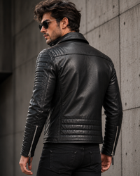 Man wearing a black leather jacket in MotorBiker style with Padded Sleeves and Silver Zippers and Poppers