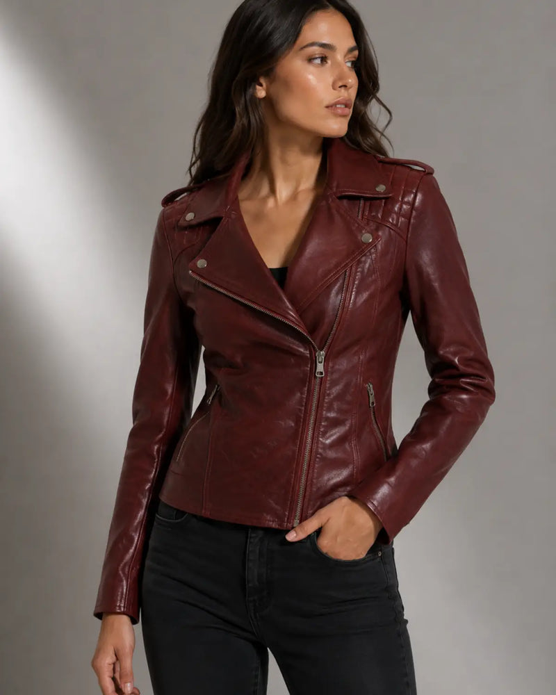 Woman wearing a burgundy Moto Biker Leather jacket with Silver zippers
