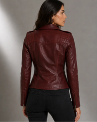 Woman wearing a burgundy Moto Biker Leather jacket with Silver zippers