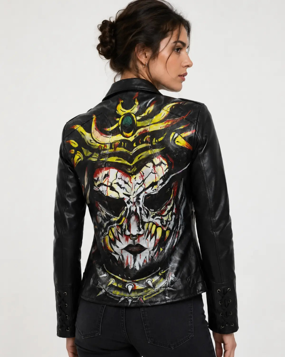 Women's black hand painted leather jacket with colorful fantasy skull artwork on the back
