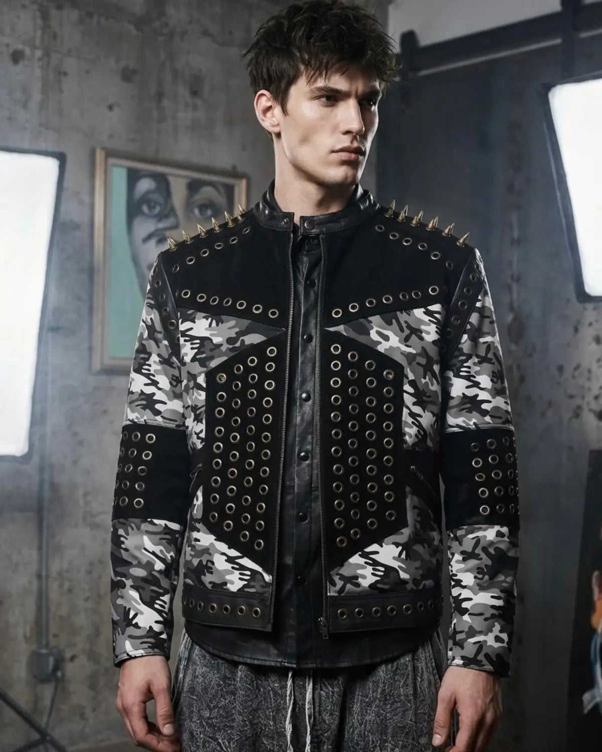 Men wearing a camouflage jacket with studs in an industrial setting