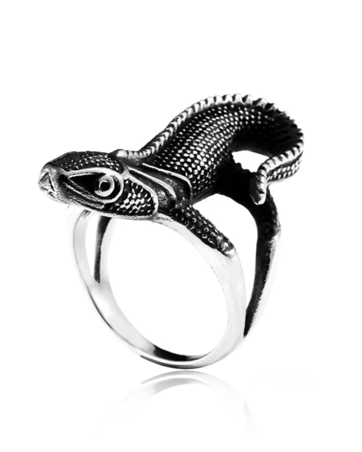 A silver-toned ring featuring a highly detailed, textured lizard or gecko head and body wrapped around the band, shown on a clean white background with a soft reflection.