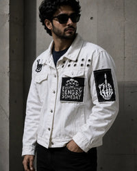 Handmade white denim men's jacket with printed graphic patches and gothic details
