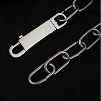 A close-up of a silver metal chain accessory with a rectangular clasp and interlocking oval links, Star Inverted Pentagram Chain Statement Necklace with big star