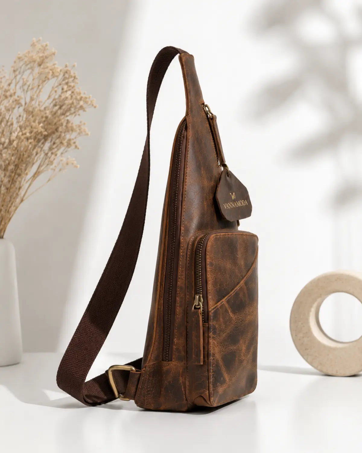 Distressed leather sling backpack front view