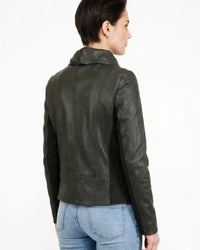 A woman shown from the back wearing a dark olive green leather jacket and light blue jeans, photographed against a plain white studio background.