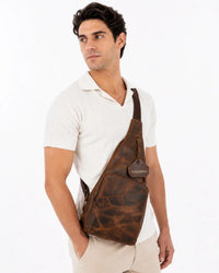 Brown leather crossbody bag with zipper pockets