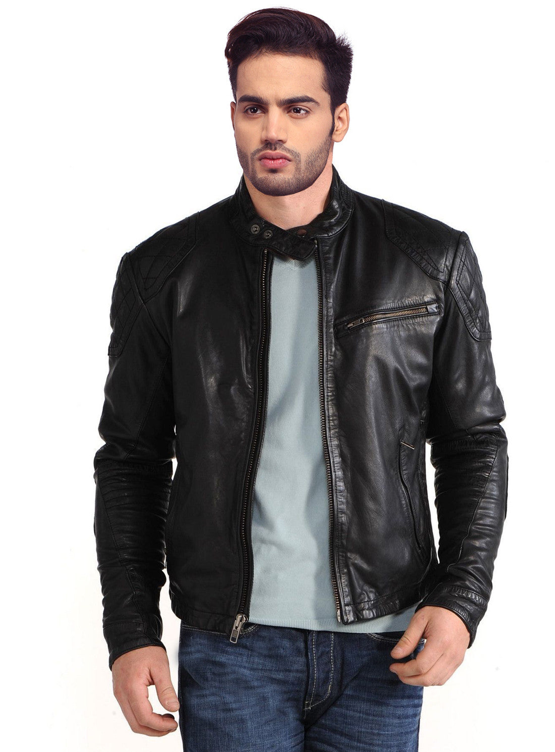 A man wearing a black quilted motorcycle leather jacket with antique silver zippers and multiple zipped pockets.